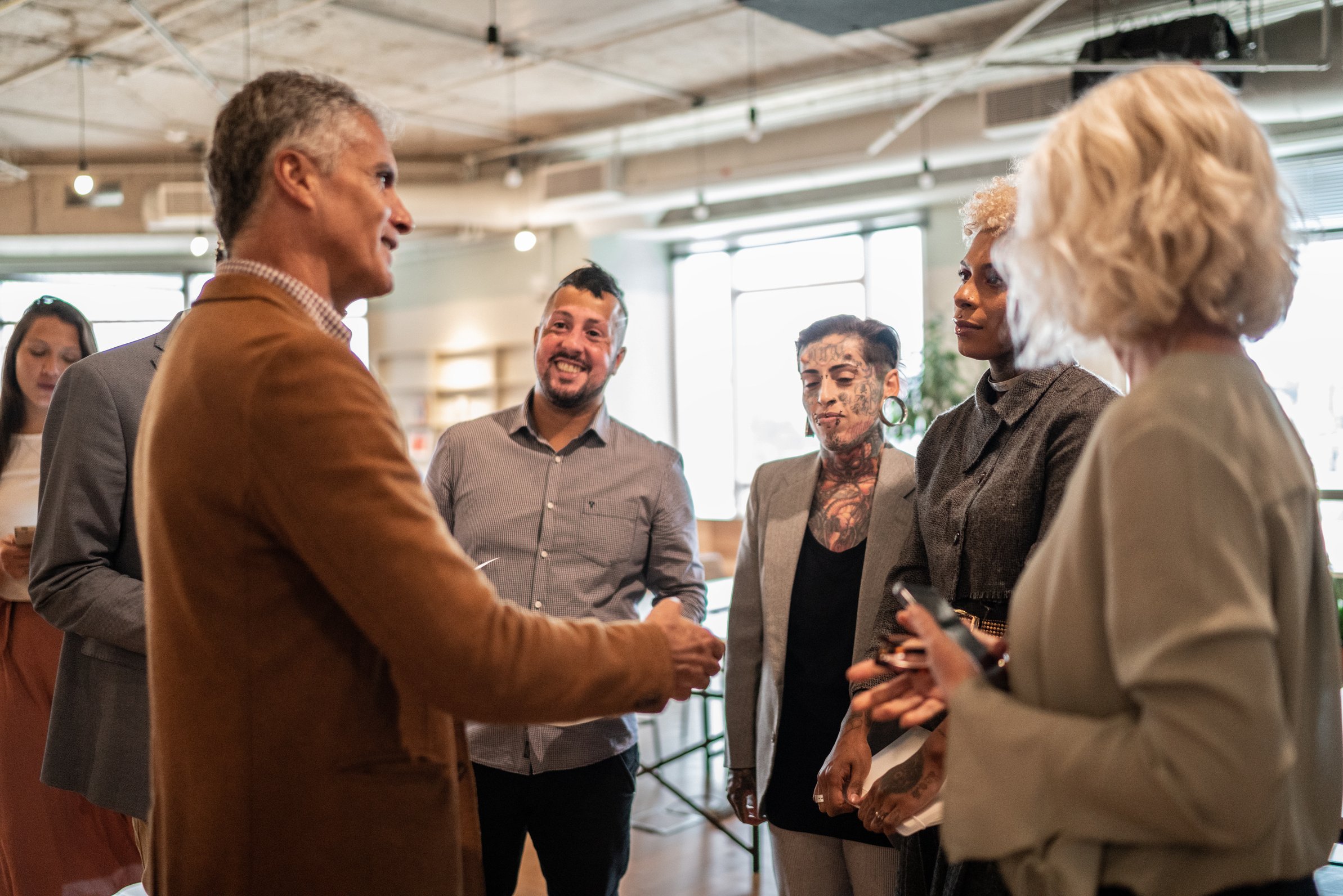 Business people shaking hands at business event